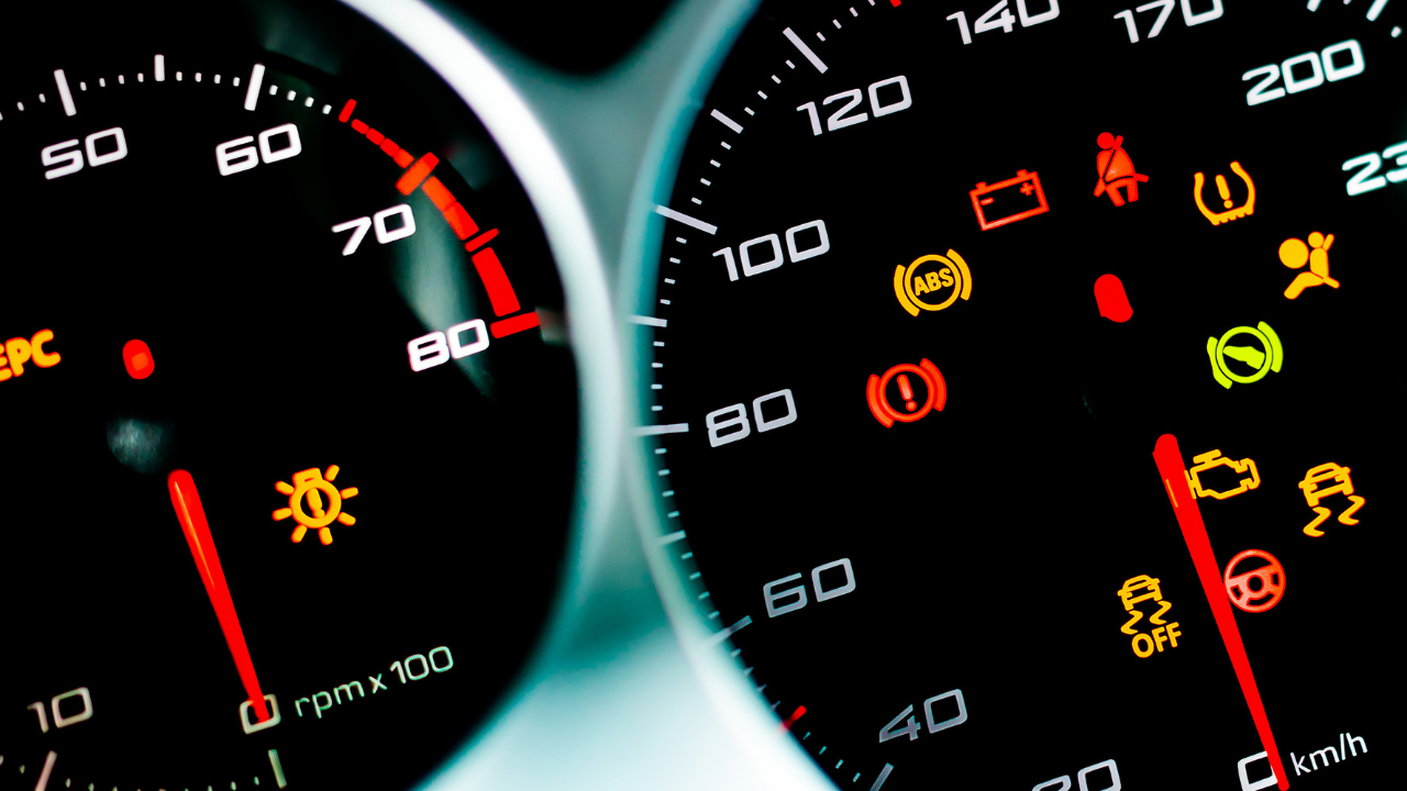 Car dashboard. Checking the system when starting the engine. A close-up of the speedometer and tachometer with additional instruments is illuminated.