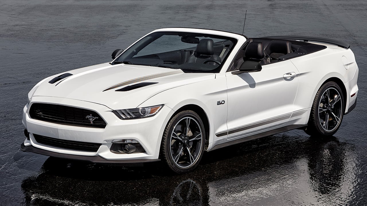 An S550 Ford Mustang GT Convertible in white, front 3/4 view, roof down