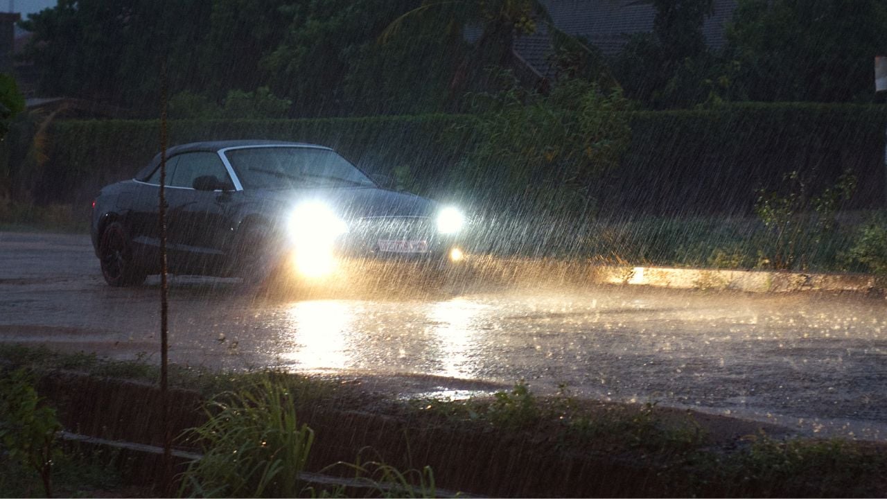 Black Audi with High Beams in Rain Storm