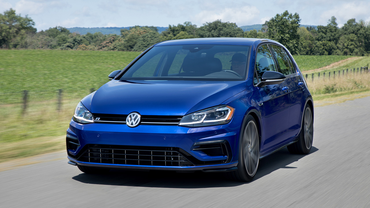 A blue Mk7 Volkswagen Golf R on the move, front 3/4 view