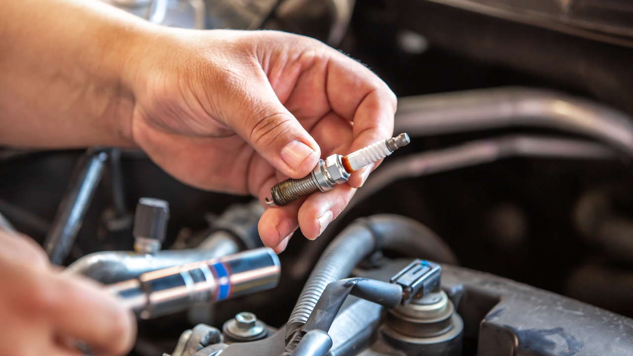 Combustion engine vehicle maintenance, replace of spark plugs