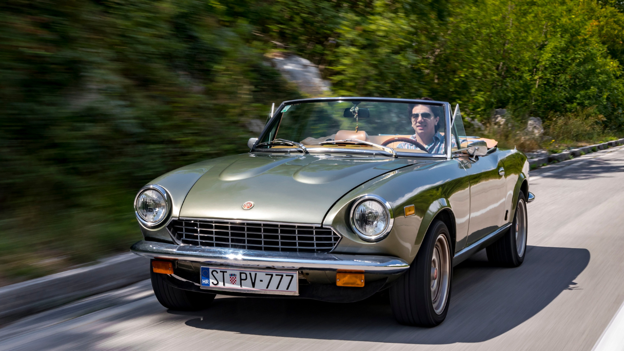 Fiat driving down the road