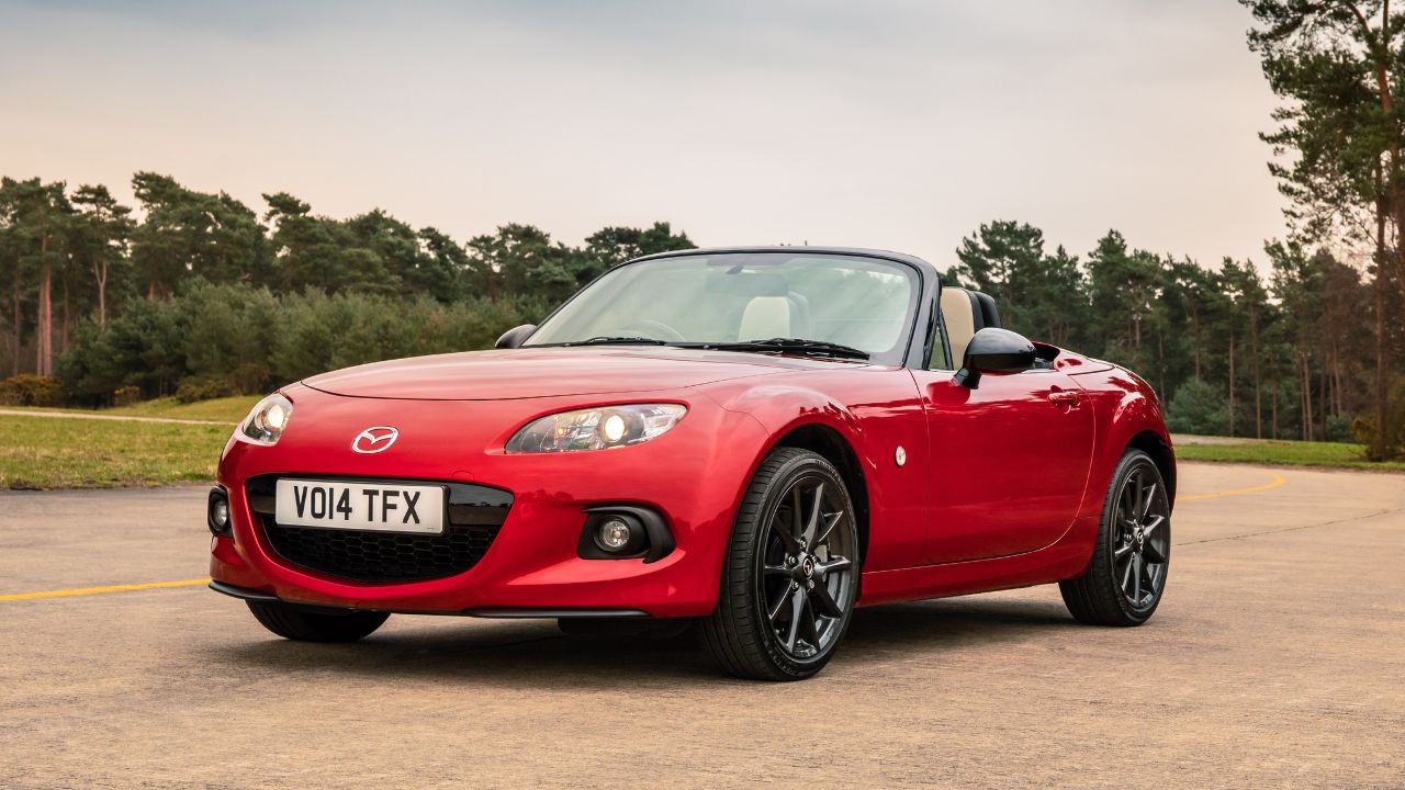 Red 2015 Mazda MX-5 NC Parked With Roof Down Front 3/4 View