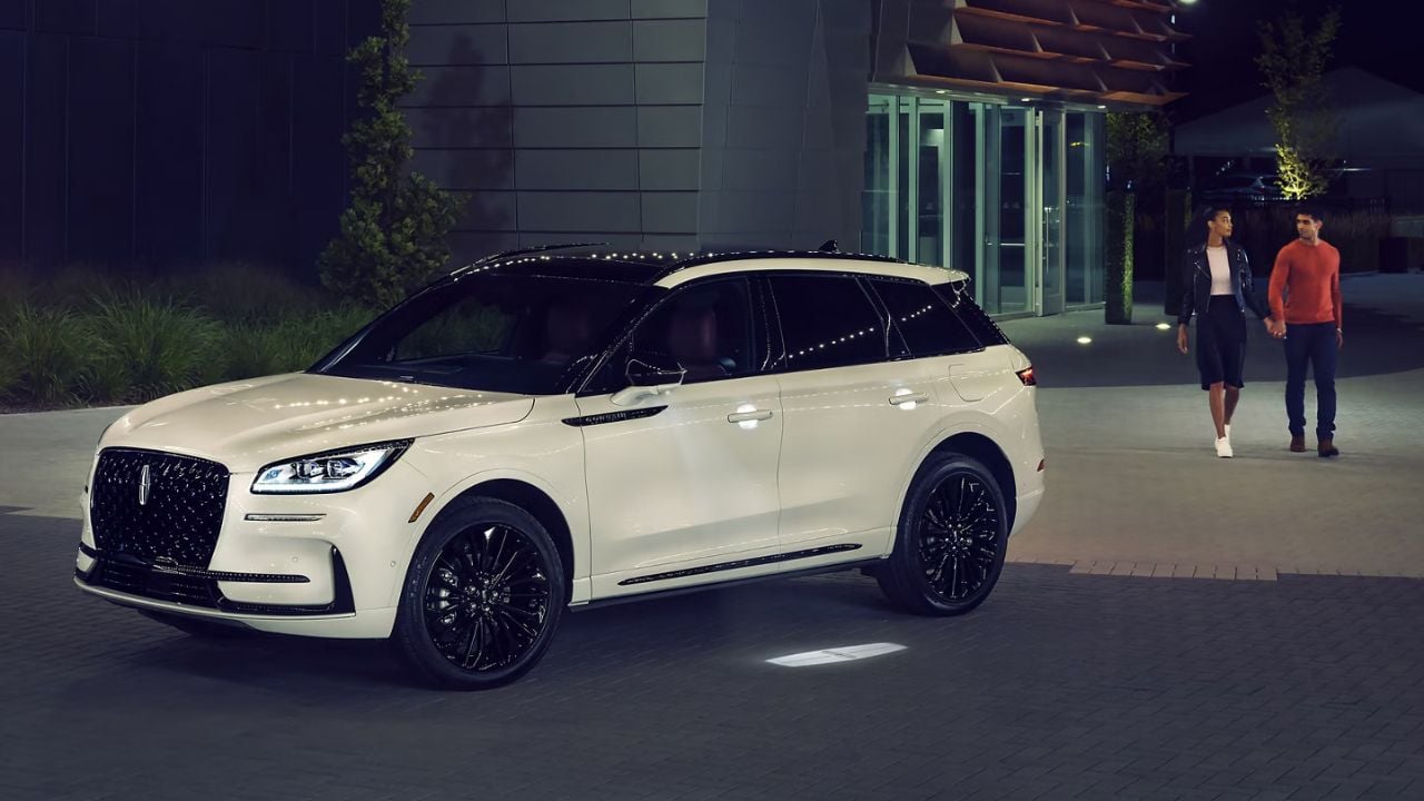 A white 2025 Lincoln Corsair at night.