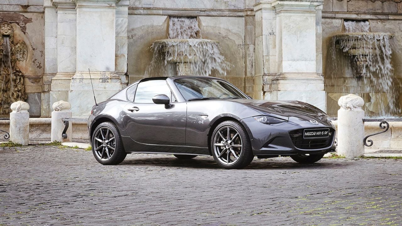 Grey 2016 Mazda MX-5 RF Parked With Roof Down Front 3/4 View