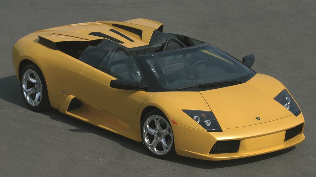 Yellow Lamborghini Murcielago Roadster Parked With Roof Down Front 3/4 View