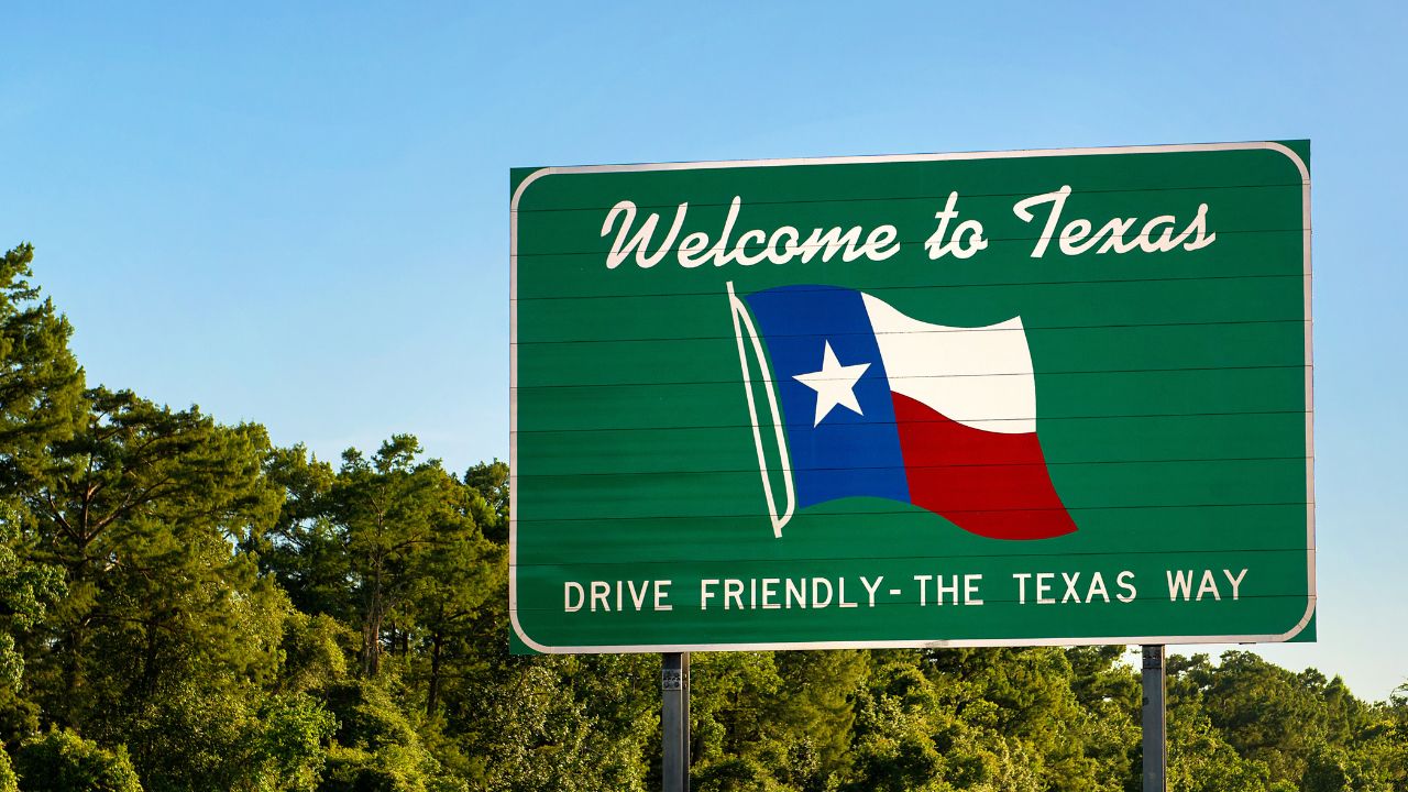 Welcome to Texas sign - panorama view with trees