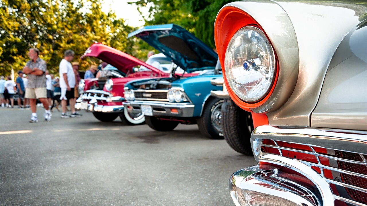 Vintage cars on display at classic automotive exhibition.