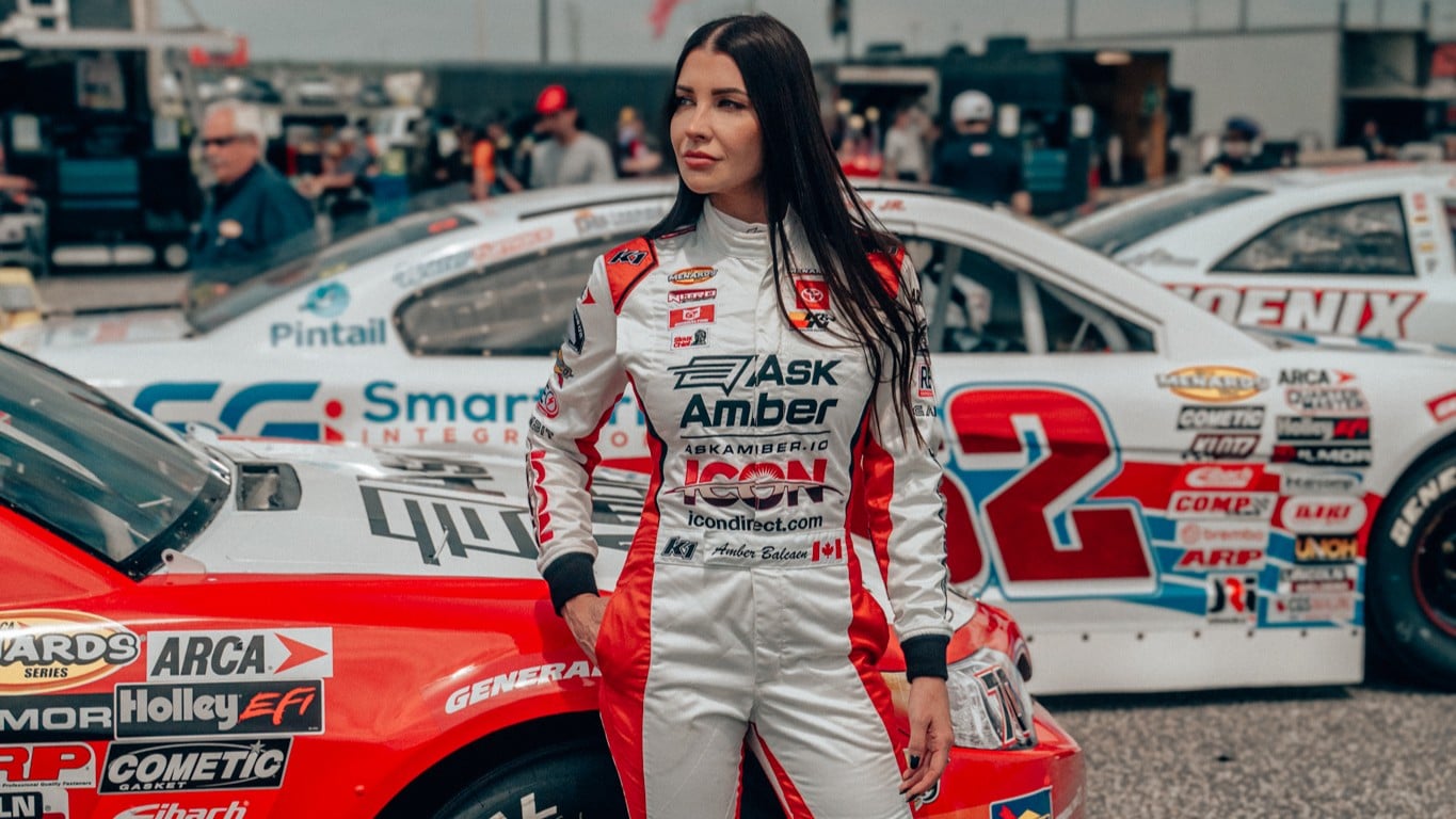 Amber Balcaen in front of her car.