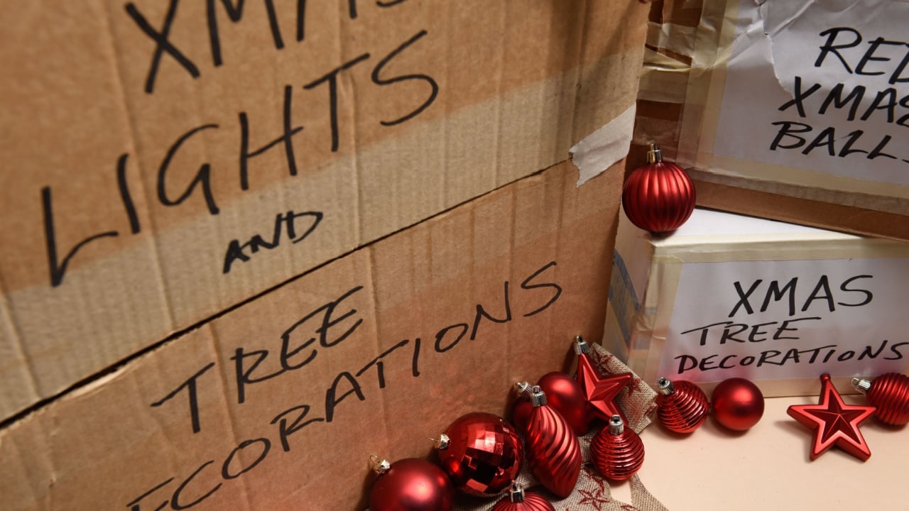 Boxes and containers of festive christmas lights and decorations