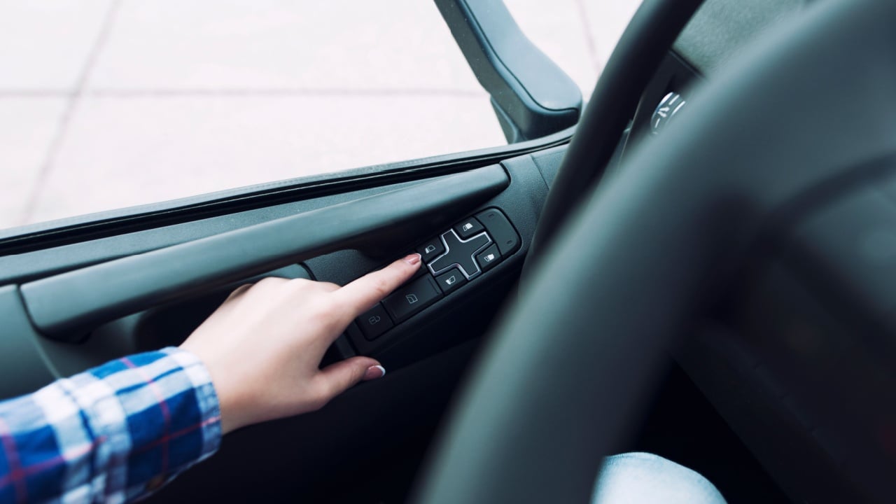 Rolling down the window of a car