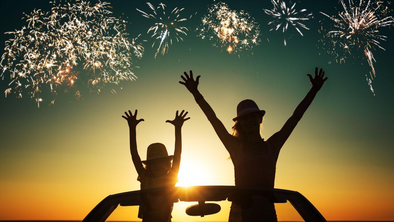 Silhouette of happy family at the beach against sunset sky and sea background. People traveling by car. Summer vacation and travel concept