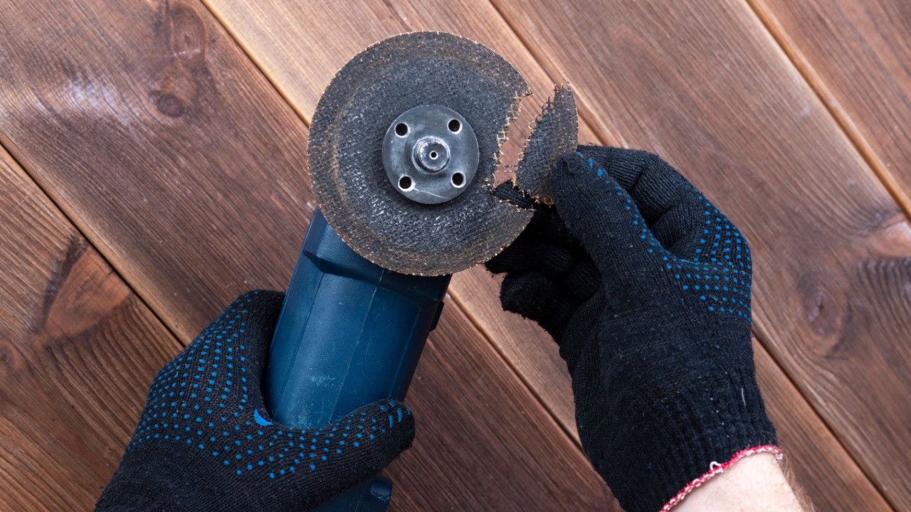 A grinder with a broken blade on a wooden table