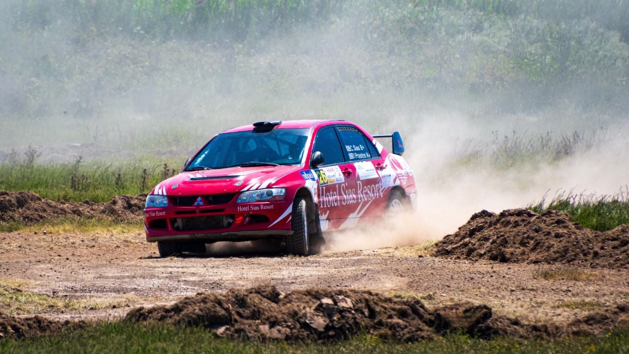 Understeer - Close up view of a Mitsubishi Evo rally car racing during an off-road timed race in a free to public entrance event in Triodos, Messenia, Greece