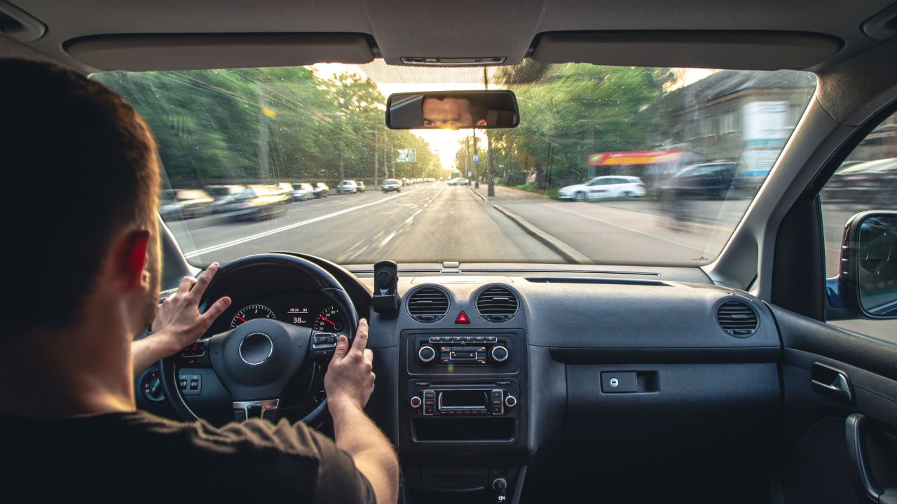 Hands on the wheel when driving at high speed from inside the car.