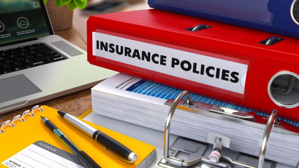 Red Ring Binder with Inscription Insurance Policies.
