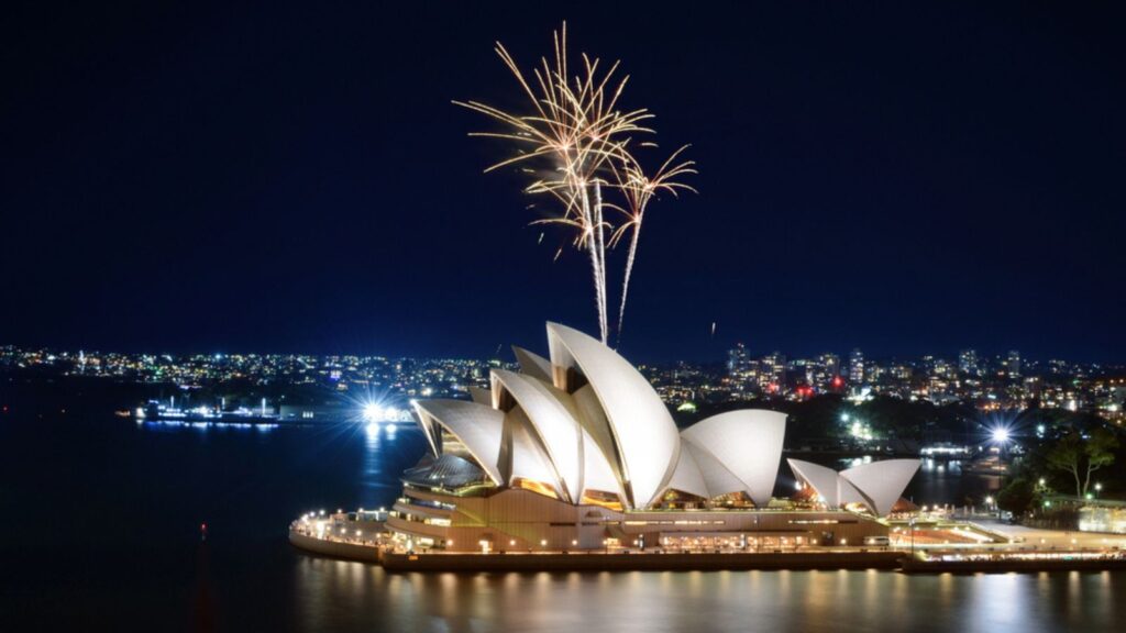 SYDNEY, AUSTRALIA - MARCH 8, 2018 - Blast of gold sprinkler-like fireworks at the Sydney Opera House