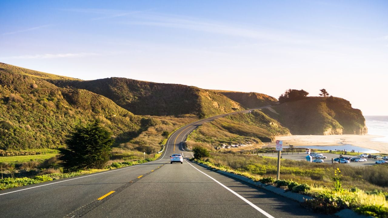 Driving on Highway 1 on the Pacific Ocean coastline close to Half Moon Bay, California