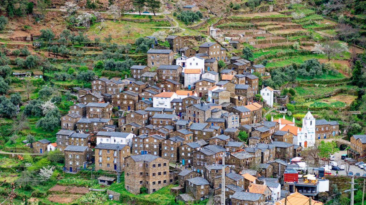 View of the Piodão village in Portugal. Rural tourism. Beautifully built upon the ledges of the mountain, the village of Piódão is harmoniously carved into nature with its schist houses and streets.