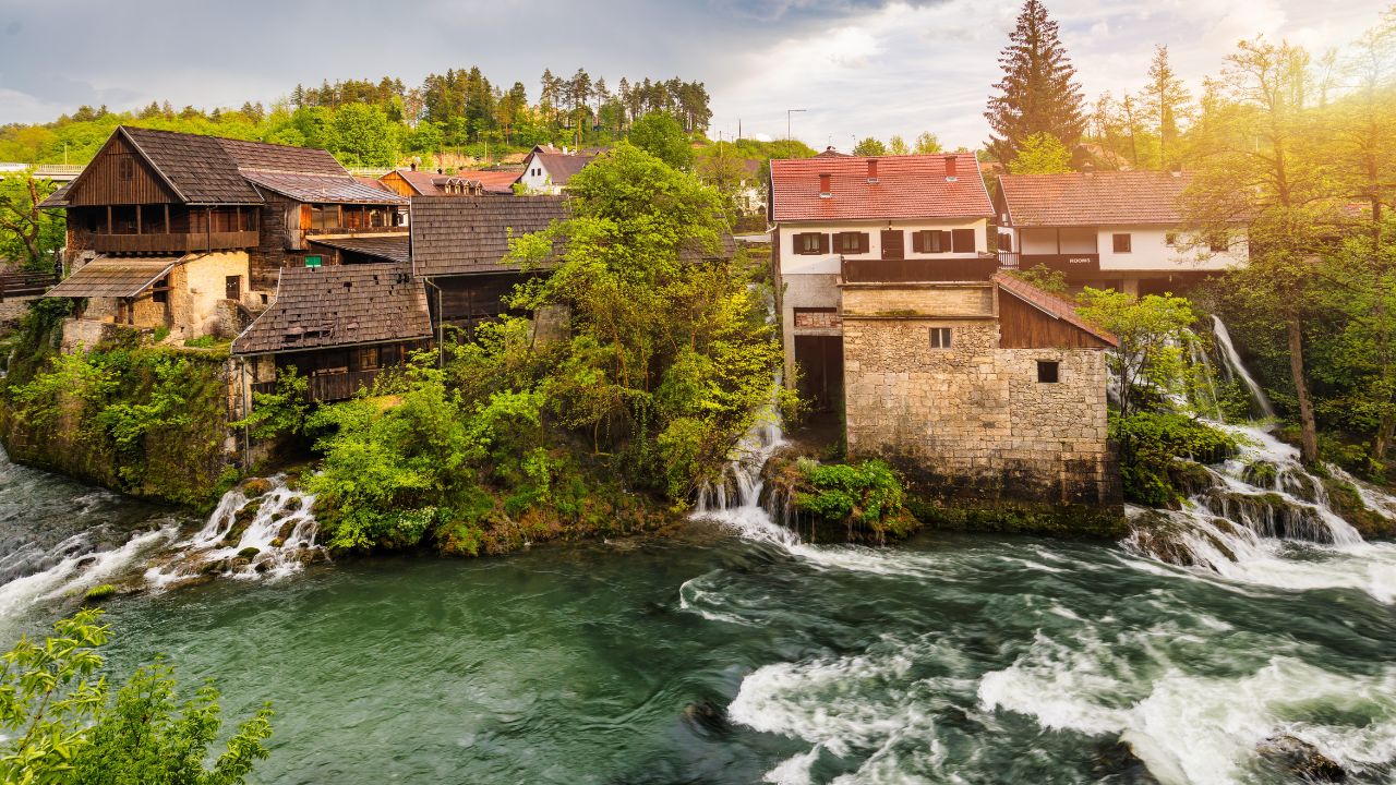 Village of Rastoke near Slunj in Croatia, old water mills on waterfalls of Korana river, beautiful countryside landscape. Landscape with river and little waterfalls in Rastoke village, Croatia.