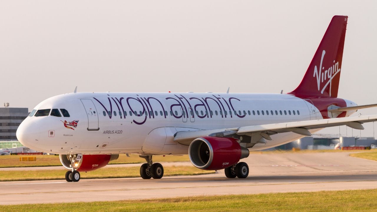 MANCHESTER, LANCASHIRE/ENGLAND - NOVEMBER 29, 2013: Virgin Atlantic Airbus A320 on runway waiting for take off at Manchester Airport