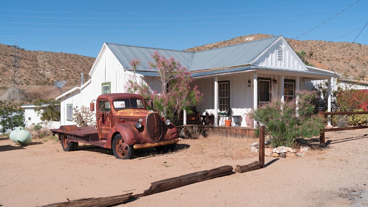 RANDSBURG, CALIFORNIA/USA - MAY 27, 2019: image showing a home and a derelict truck.