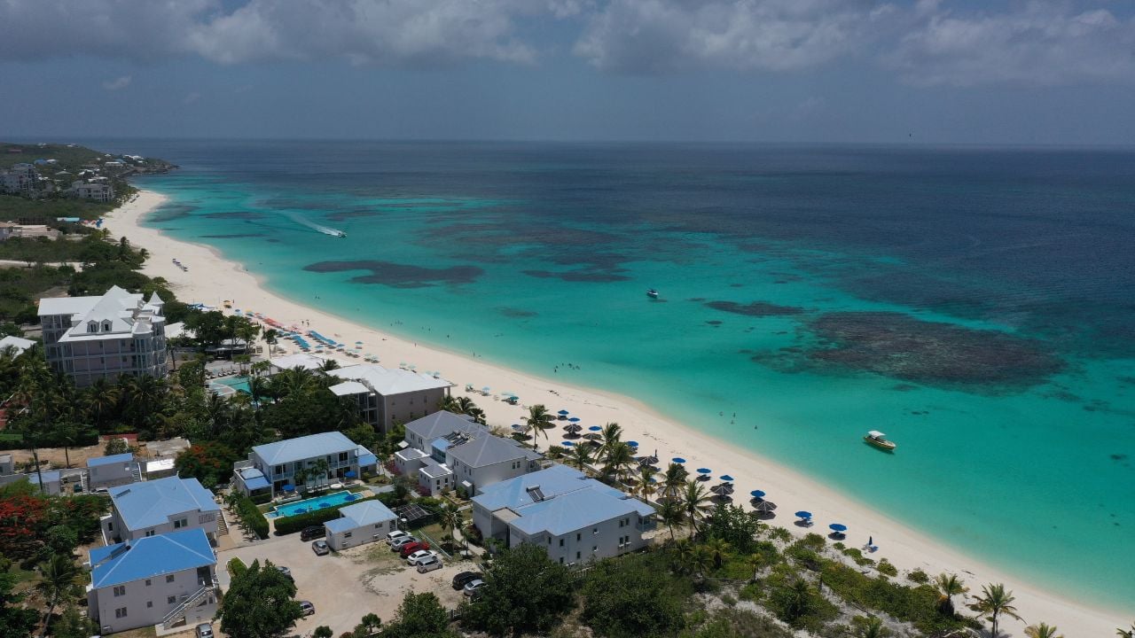 A serene coastal scene featuring a sandy beach in Shoal Bay East in Anguilla