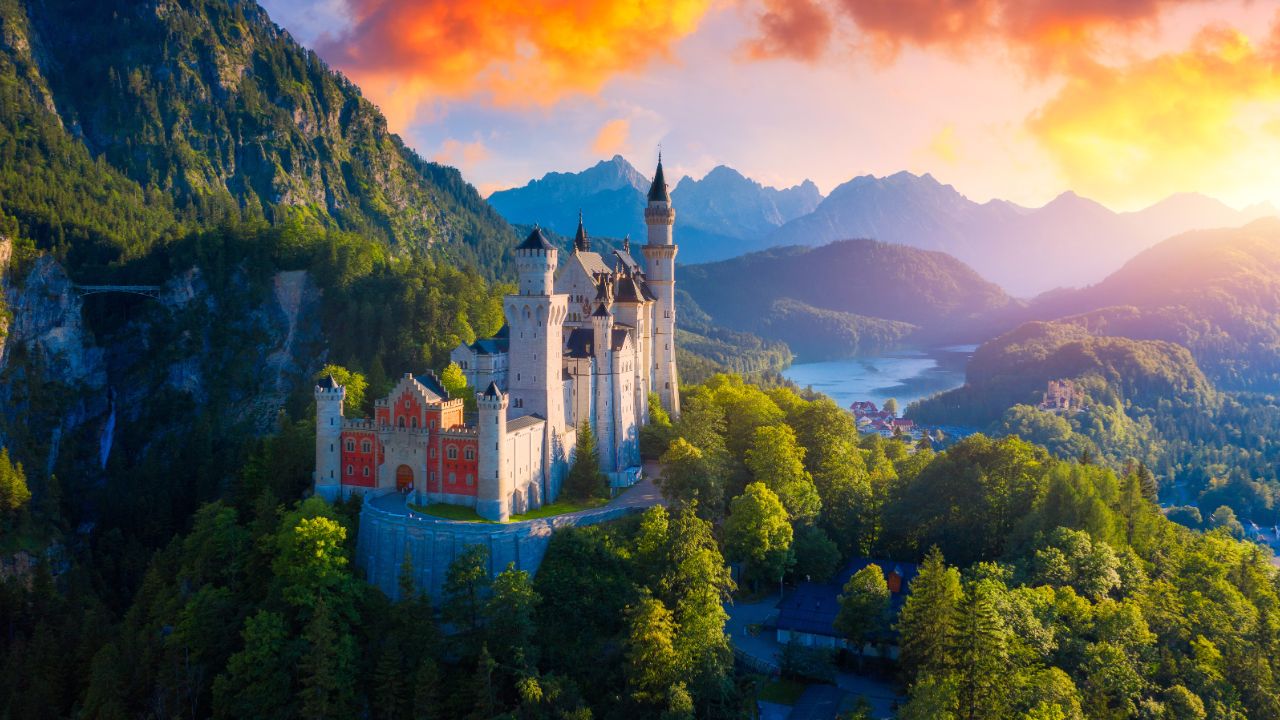 Famous Neuschwanstein Castle with scenic mountain landscape near Fussen, Bavaria, Germany. Neuschwanstein Castle in Hohenschwangau, Germany.