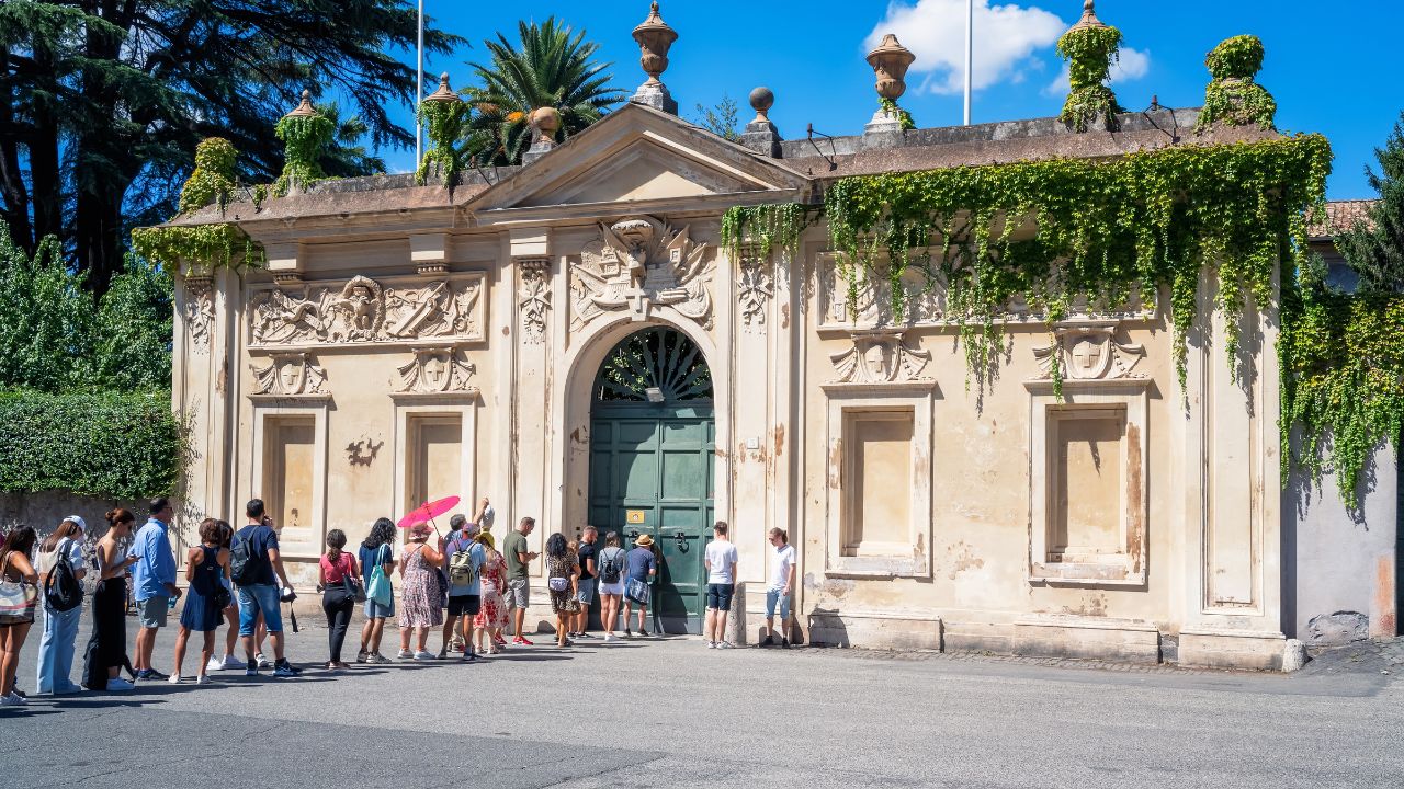 Rome, Italy - September 11, 2022: Queue of tourists waiting to see Saint Peter dome from the hole of the door of Villa del Priorato of Malta on Aventino Hill at Knights of Malta square, Rome, Italy