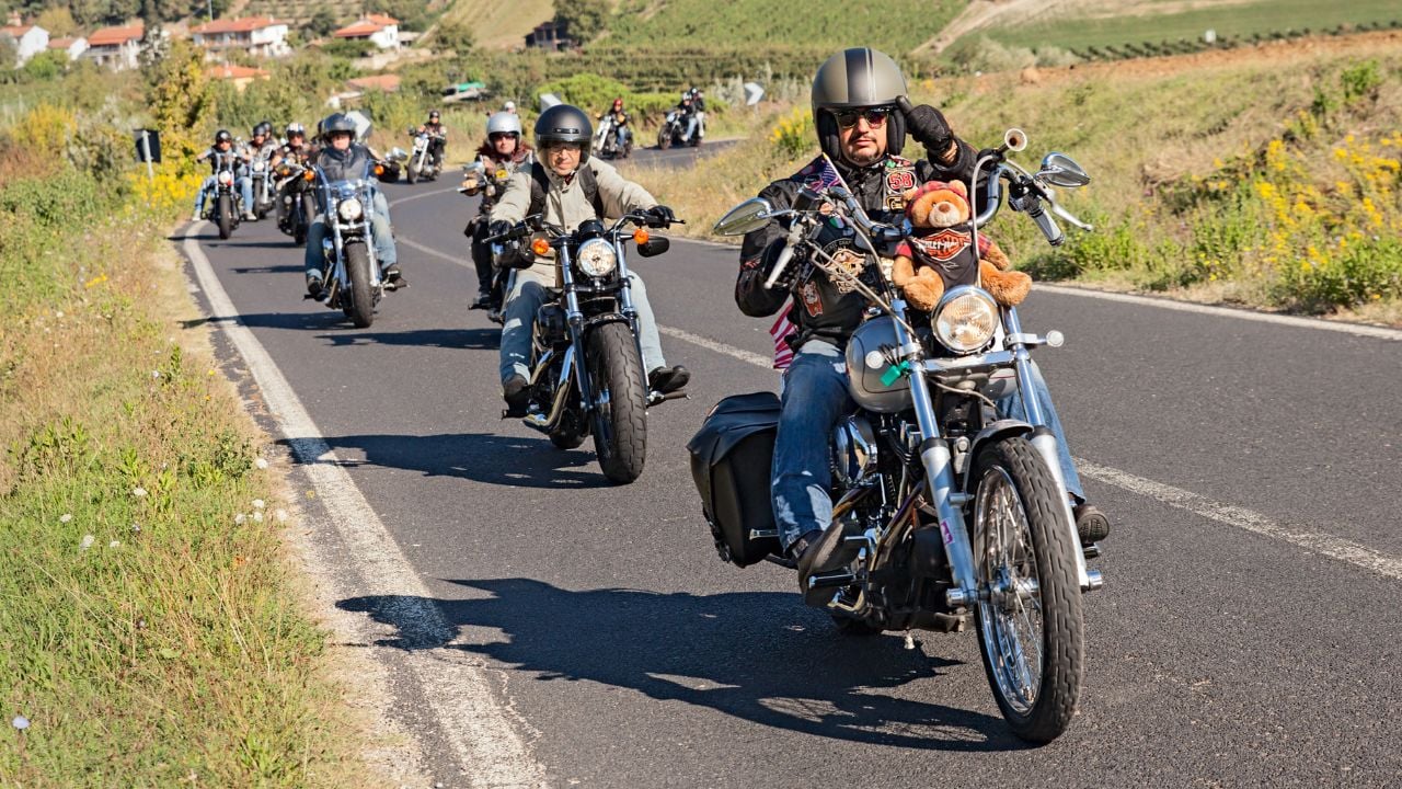 a group of bikers riding american motorbikes Harley Davidson in motorcycle rally "Sangiovese tour" by Ravenna Chapter