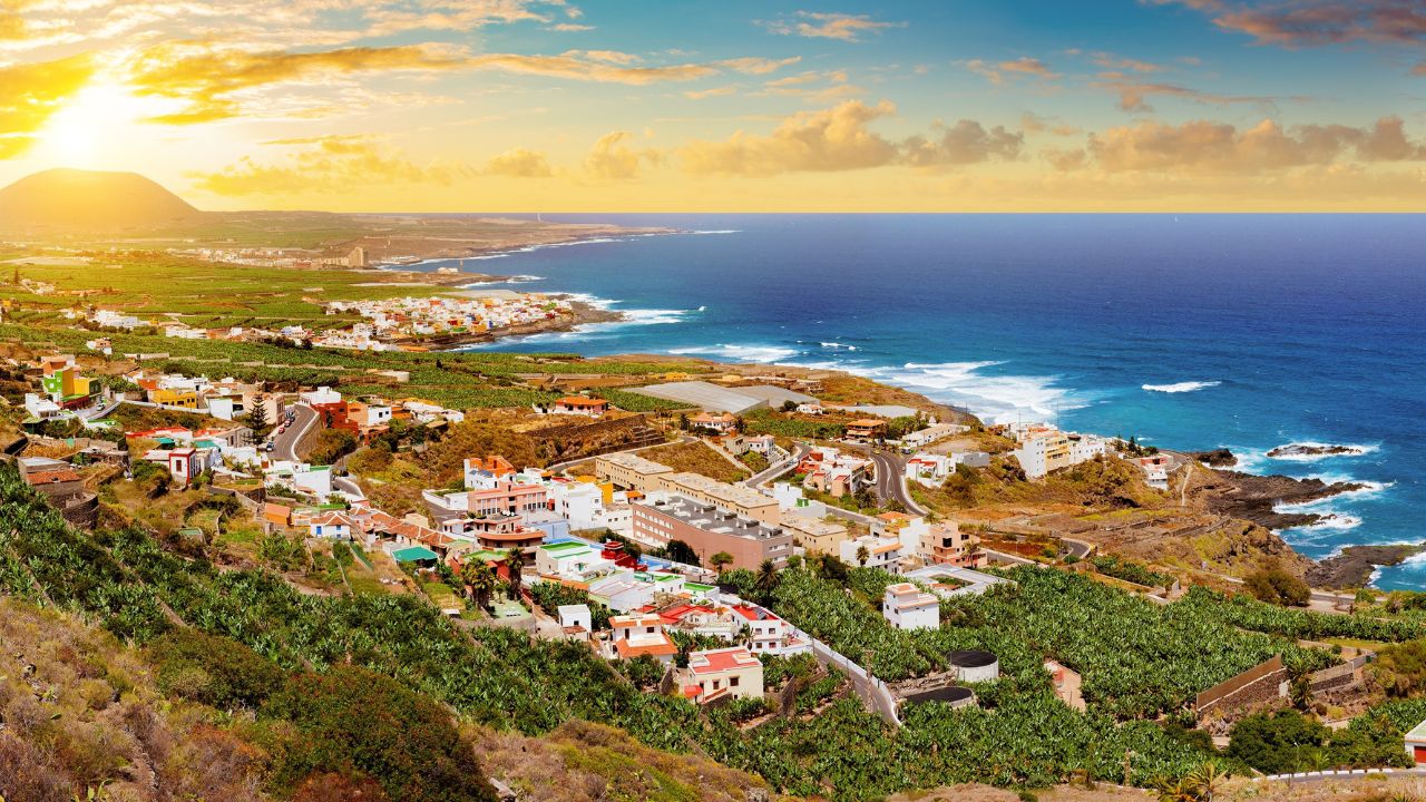 Landmark and tourism in Canary Islands.Spain beaches. Sunset panorama village coast and field of banana trees in Tenerife.