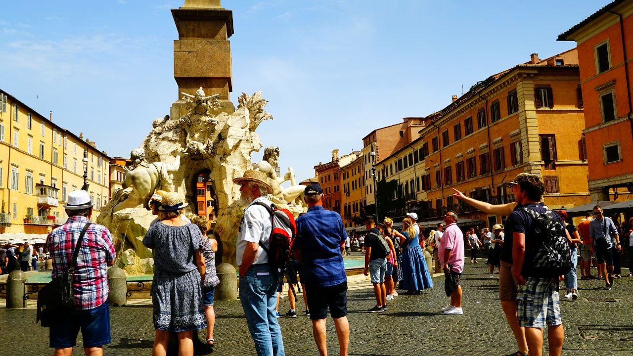 Tourists taking photos in Piazza Navona in Rome, Italy