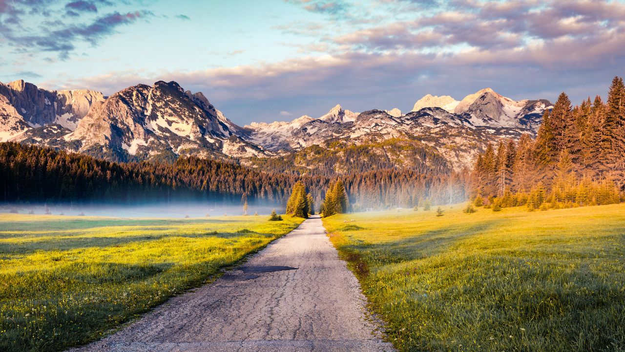 Amazing summer sunrise in Durmitor Nacionalni Park. Exciting foggy view of of Montenegro countryside, Zabljak town location. Beautiful world of Mediterranean countries. Traveling concept background.