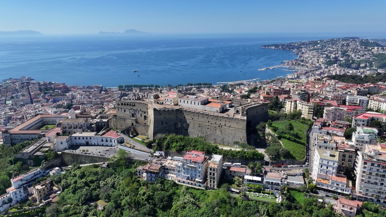 Naples skyline and bay with Castel Sant’Elmo above the coast.