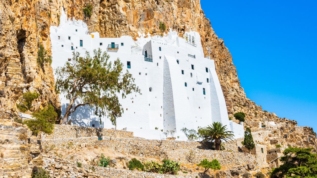 Famous white building of Panagia Hozoviotissa monastery hanging on the cliff side above the sea, Amorgos island, Cyclades, Greece