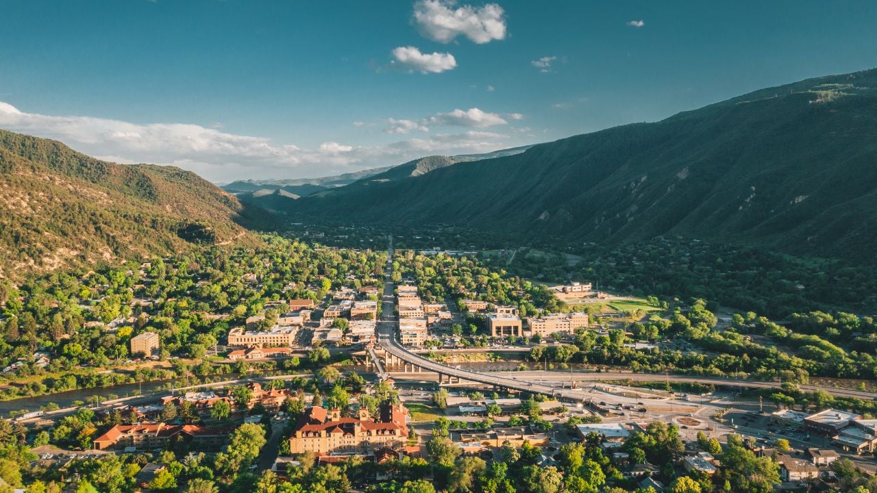 Aerial view of the Town of Glenwood Springs, Colorado in the Roaring Fork Valley and the Grand Avenue Bridge going over the Colorado River.
