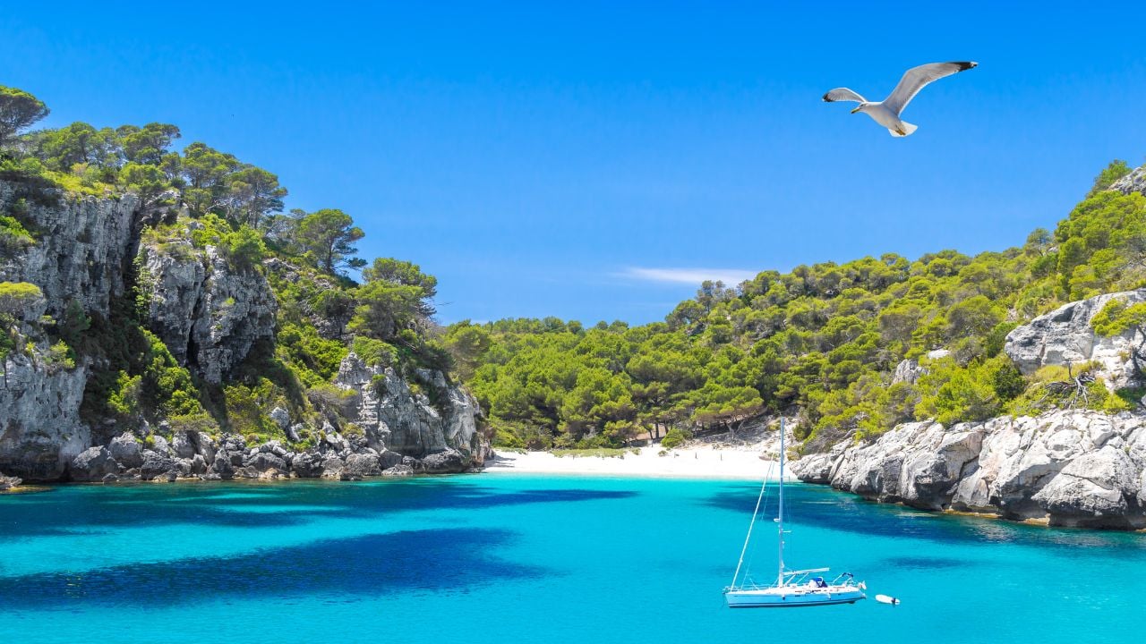 Cala Macarelleta Beach with Turquoise Water of Mediterranean Sea. Menorca Island Travel Background.