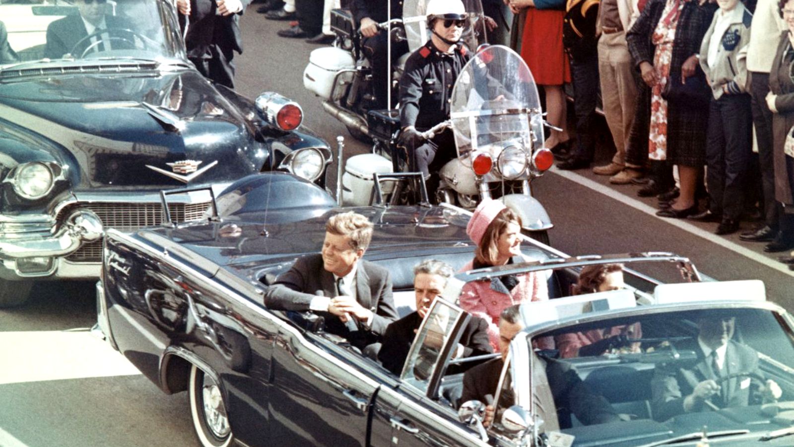 Picture-of-President-Kennedy-in-the-limousine-in-Dallas-Texas-on-Main-Street-minutes-before-the-assassination.-Also-in-the-limousine-are-Jackie-Kennedy-Texas-Governor-John-Connall