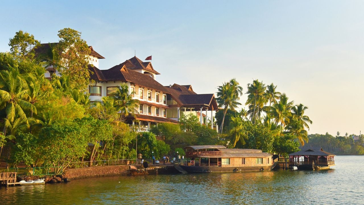 Kollam, Kerala, India, December 01, 2019: The Raviz Ashtamudi, a five-star hotel on the banks of the Ashtamudi lake. View from a boat. Incredible India.
