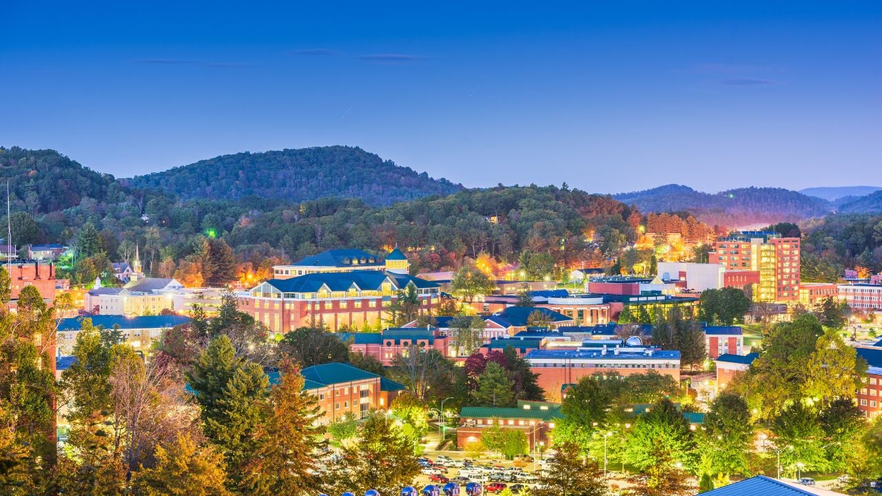 Boone, North Carolina, USA campus and town skyline at twilight.