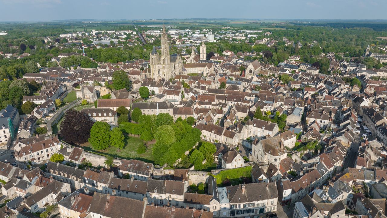 Aerial view of medieval town center of Senlis with Gothic cathedral and roman walls, circular streets