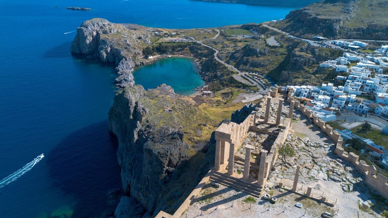 Rhodes, Greece. Lindos small whitewashed village and the Acropolis, scenery of Rhodos Island at Aegean Sea.