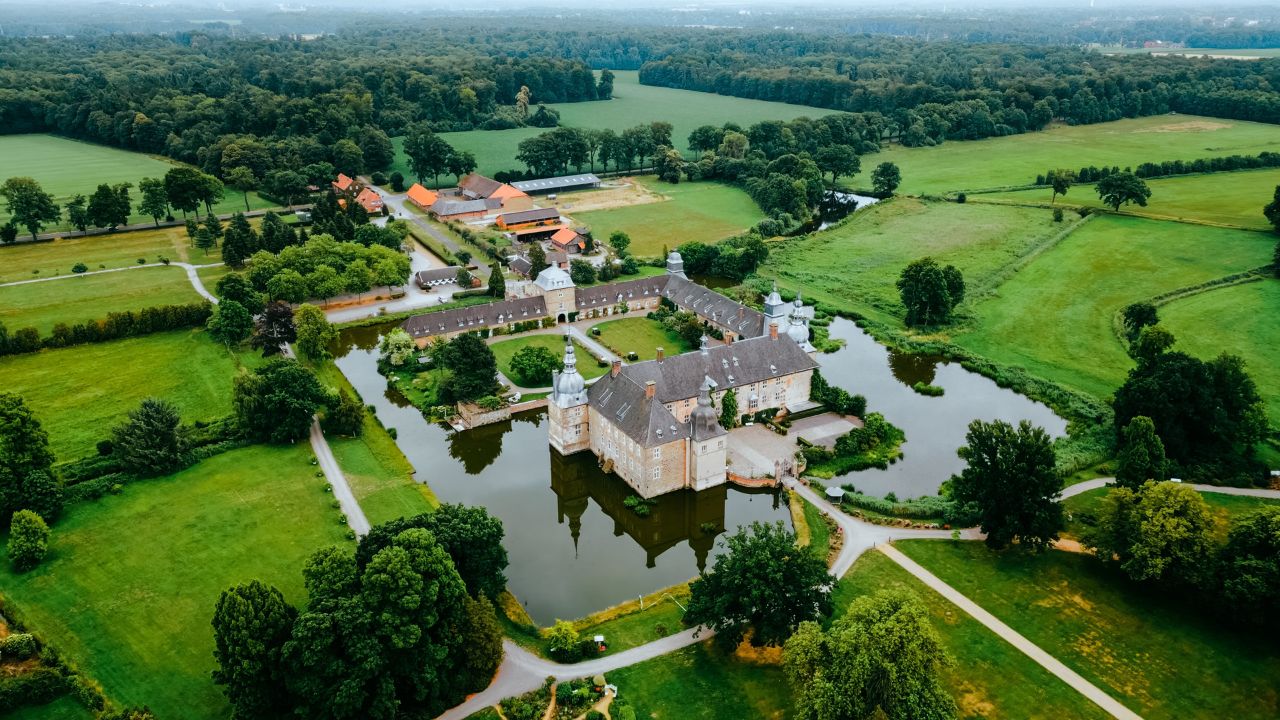 Aerial drone view medieval castle Lembeck, Nordrhein westfalen, Germany in summer day. Lembeck, Germany. June 21, 2023