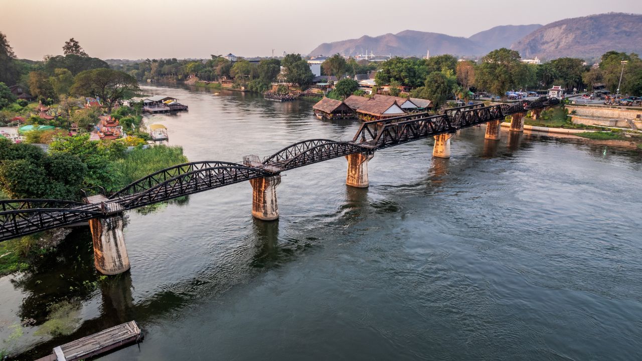 Aerial view of the death railway bridge crossing river Khwae in Kanchanaburi one of important historical traveling site Thailand. This bridge is famous for its history in WW2.