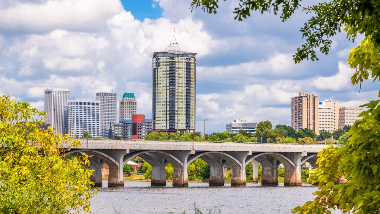 Tulsa, Oklahoma, USA downtown skyline on the Arkansas River in the afternoon.