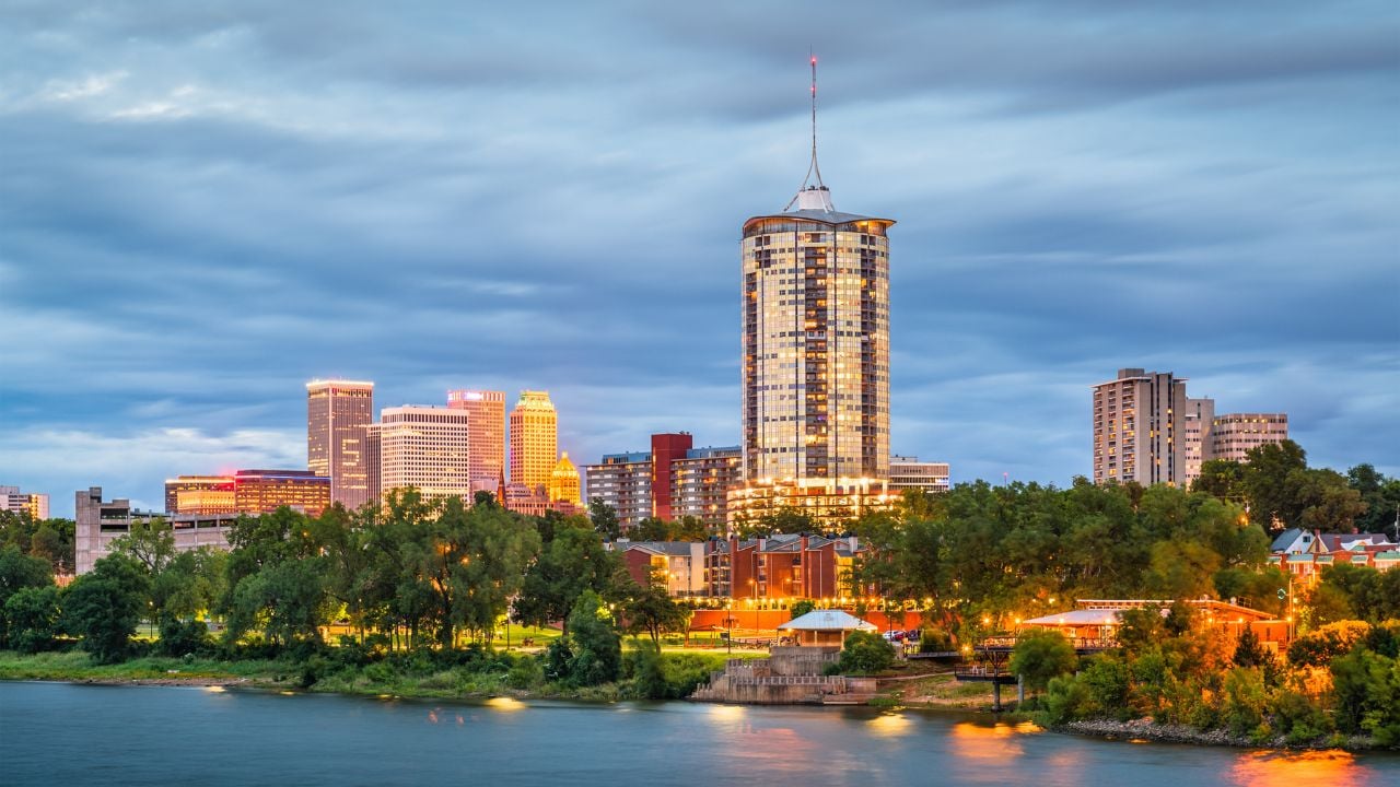 Tulsa, Oklahoma, USA downtown skyline on the Arkansas River at dusk.