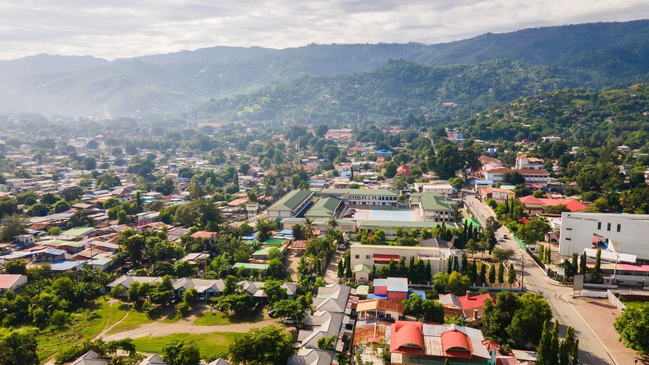 One part of Dili city seen from the height, residential and business area. Dili city is the capital of Timor Leste. Located on the coast and surrounded by hills.