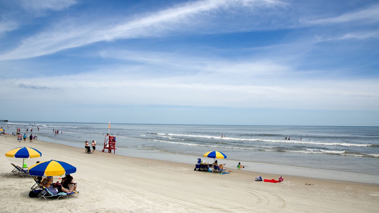 Daytona Beach,Florida,USA-04-01-2024: Editorial Tourists on Daytona Beach Florida Sandy Beach Horizontal