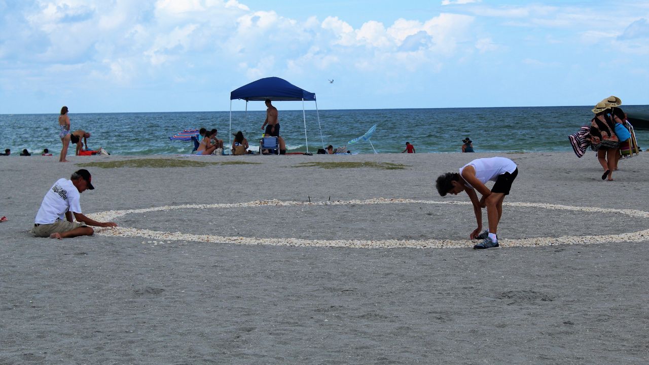 Venice,Florida/US-August 12, 2019: Venice Beach on Florida"s Gulf Coast . Caspersen Beach is a beach known for where shark teeth are found by tourists.