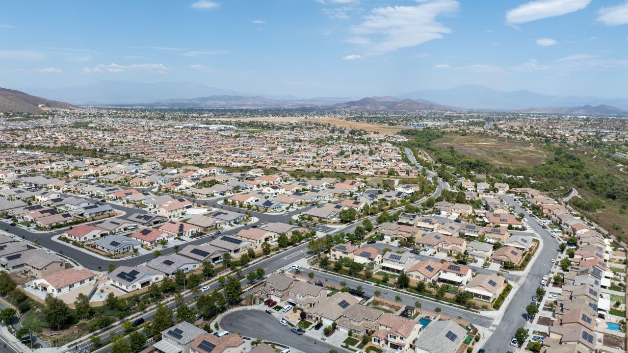 Aerial view of a sprawling neighborhood of family homes in Menifee city in Riverside County, California, United States